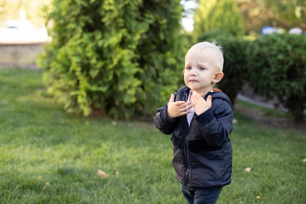 Upset little boy crying in the park