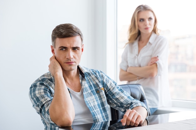 Upset man and woman having difficulties and problems in relationships