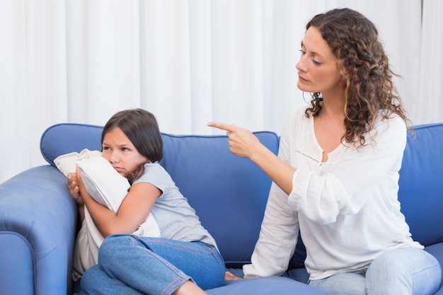 upset mother looking at her daughter 