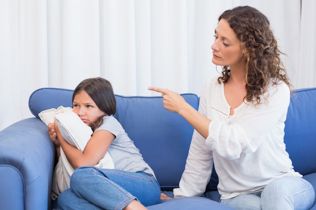 Upset mother looking at her daughter 