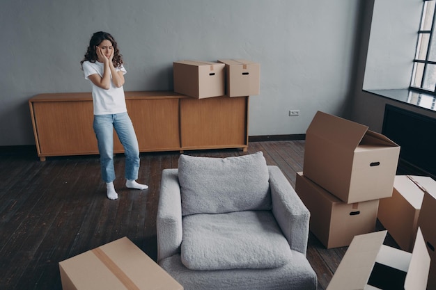 Upset puzzled woman tenant moving out rented dwelling eviction\
relocation and stress concept