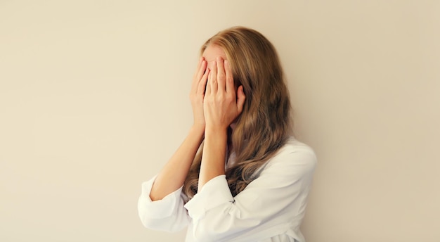 Upset sad crying woman experiencing mental or physical suffering