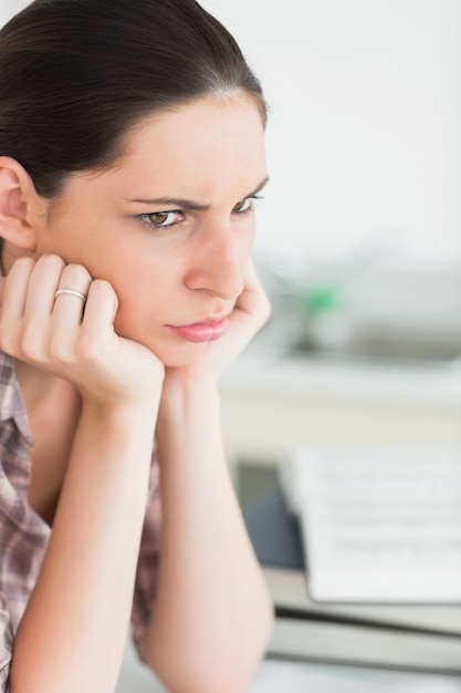 Upset woman with books