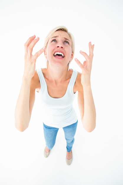 Upset woman yelling with hands up 