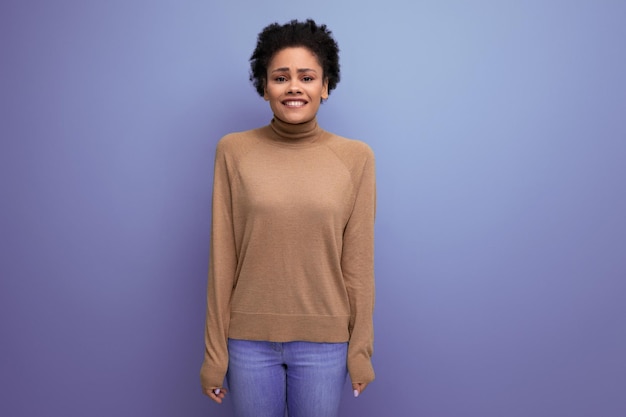 Upset young woman with swarthy skin and fluffy hair over isolated background with copy space