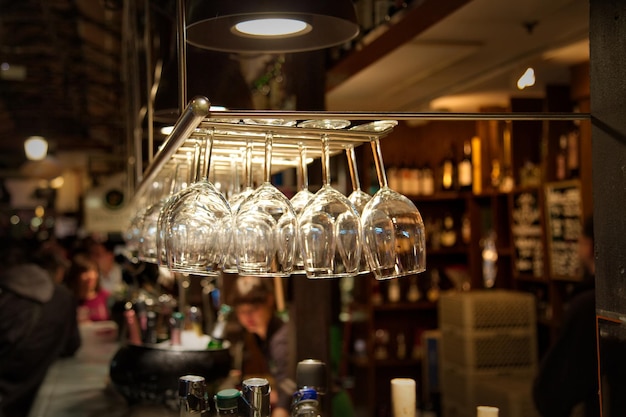 upside down image of wineglasses hanging at restaurant