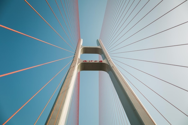 Upward view of the cable stayed bridge against blue sky jiujiang China