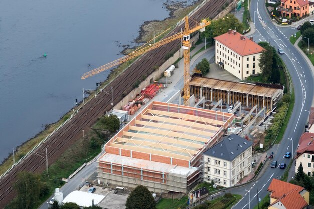 Urban infrastructure road building under construction railway\
water view from above