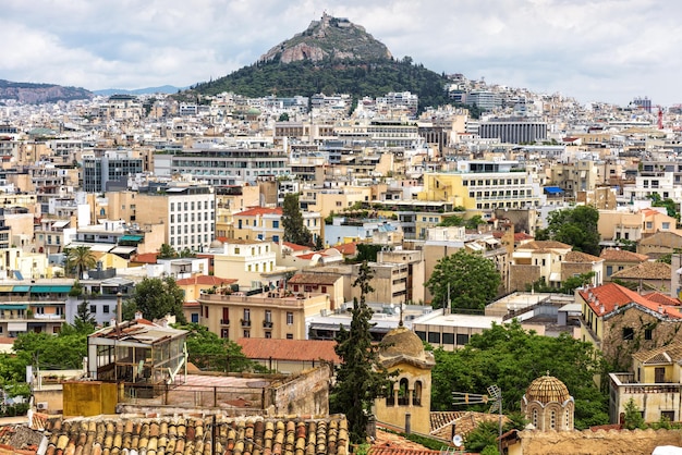 Urban landscape of Athens scenic view from Plaka district Greece Mount Lycabettus
