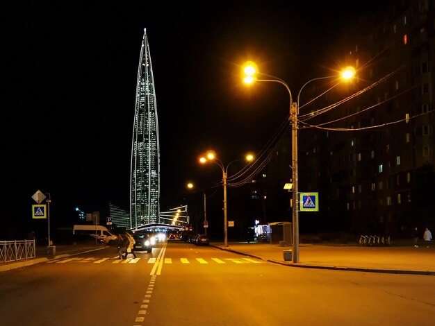 Urban landscape Night city lanterns and the Lakhta Center skyscraper