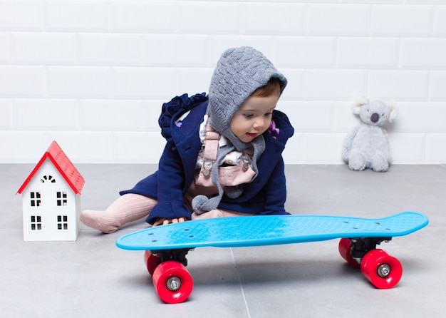 Urban look baby with skateboard