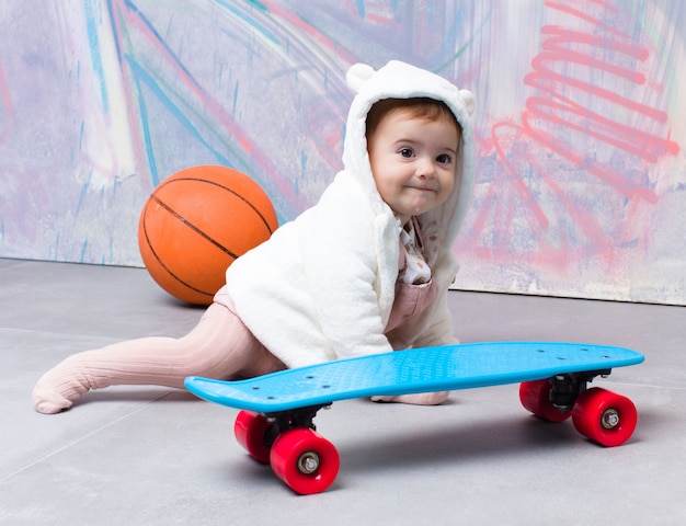 Urban look baby with skateboard