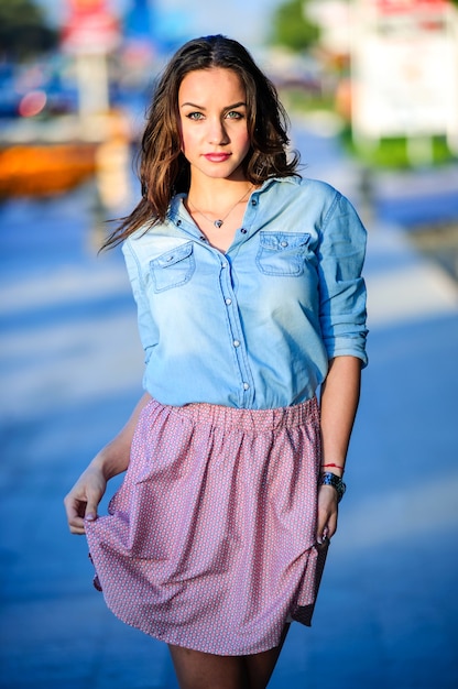 Urban portrait of young beautiful woman in the street