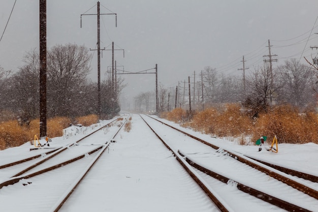 Urban railway system tracks in snow winter time