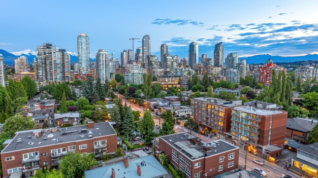 urban skyline at dusk with mountains in the background