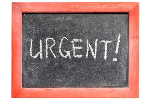 Urgent exclamation handwritten on vintage blackboard