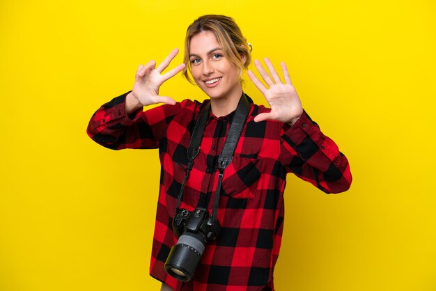 Uruguayan photographer woman isolated on yellow background counting eight with fingers