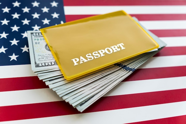 US American passport and dollars on flag background