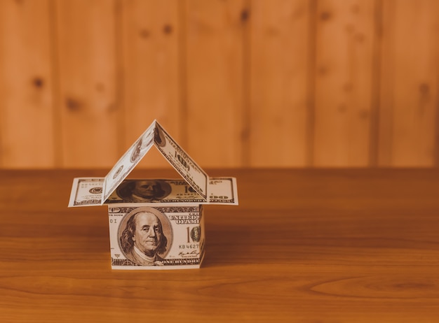 US dollar banknotes on display in the shape of a house on the expansion of the money