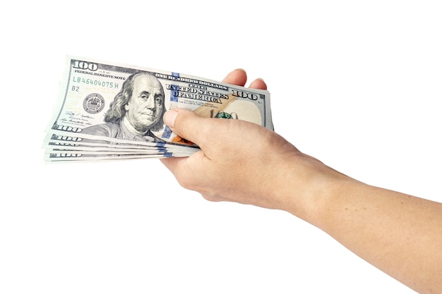 US dollars in hand isolated on white. woman's hand holds one hundred dollar bills