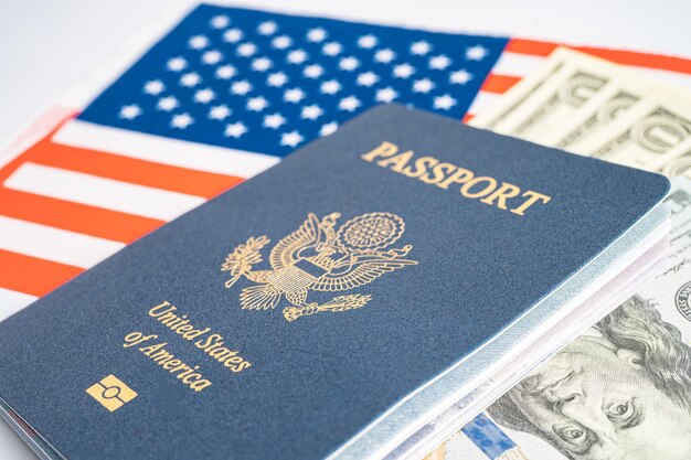 Photo us passport issued to citizen and national of the united states of america to travel in most countries outside with usa flag and dollar money