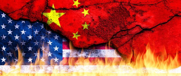 us united states of america vs china national flags on fire wall with crack conflict between countries deterioration of diplomatic relations confliction and crisis concept