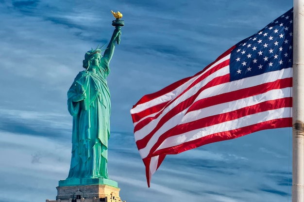 Usa American flag stars and stripes on statue of liberty blue sky background