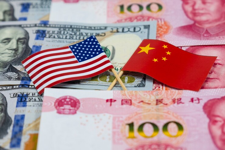 USA dollar banknotes and China Yuan banknotes with across of America flag and China flag