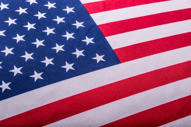 USA flag. American flag. American flag blowing wind. Close-up. Studio shot.