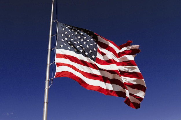 USA flag on blue sky background