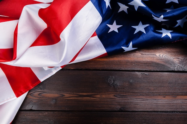 USA flag on dark wooden table background