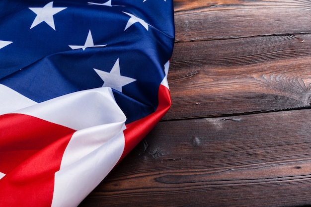 USA flag on dark wooden table