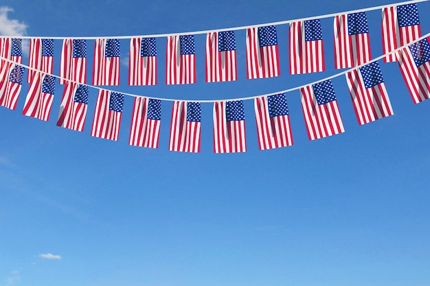 Usa flag festive bunting hanging against a blue sky d\
render