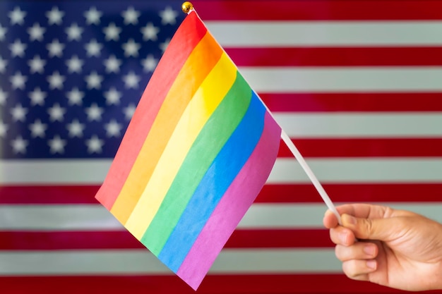 Usa flag and flag of the LGBT community The problem of the rights of sexual minorities in the country Protection and infringement of human rights nontraditional relations and politics concept