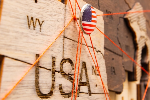 USA flag pins and red thread for traveling and planning trip