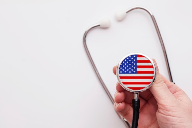 Usa healthcare concept doctor holding a medical stethoscope