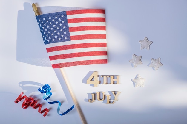 USA Independence day concept Red and blue spirals and white stars elements of USA flag top view flat lay on blue background