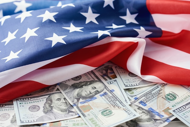 USA national flag and the dollar bills. Business and finance concept