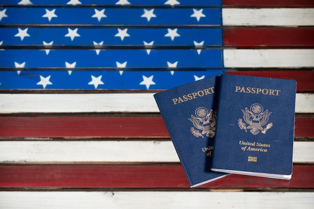 Photo usa passports on glass table over us flag