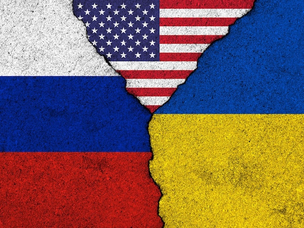 Usa russia and ukraine conflict concept flags on cracked wall\
background stop the war image