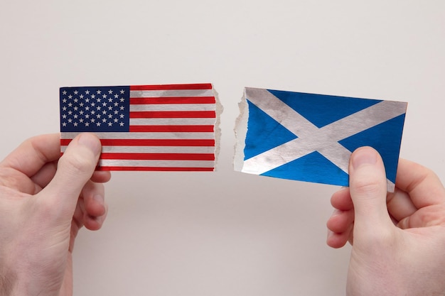 Usa and scotland paper flags ripped apart political relationship concept