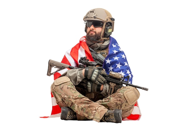 USA special forces in military equipment and with weapons sitting on a white background