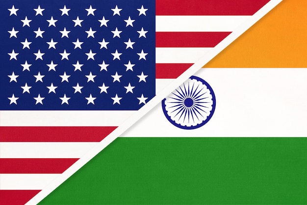 USA vs India national flag from textile. Relationship, partnership between two  countries.