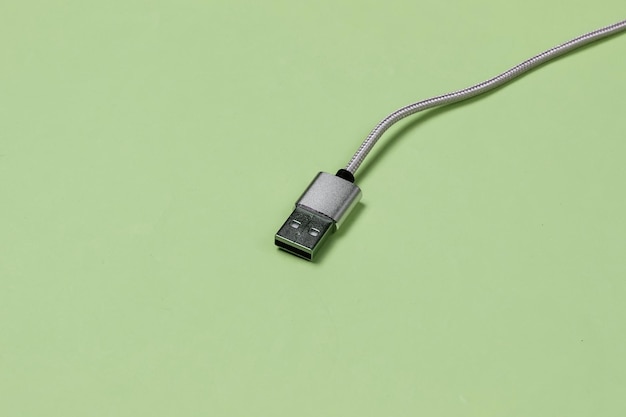 USB cable on green background close up