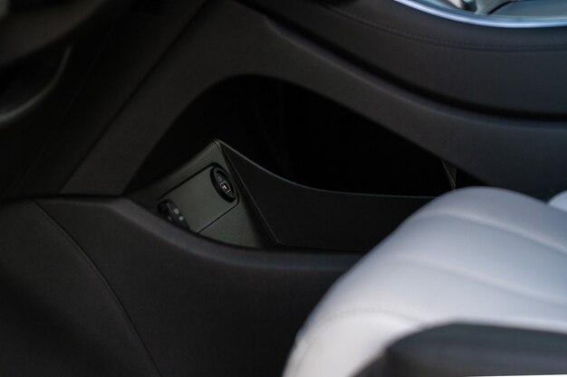 USB port in the car panel close up. Car interior detail. Car usb charger detail.