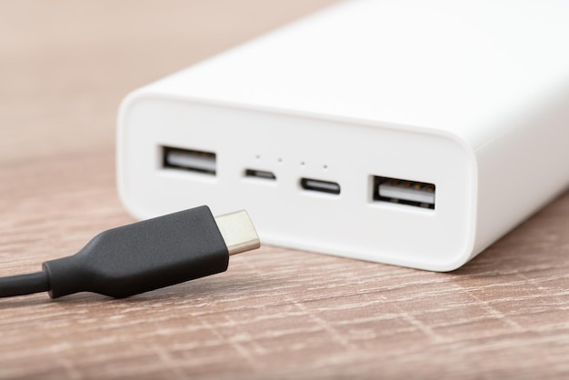 Usb Type C cable and white powerbank on the table