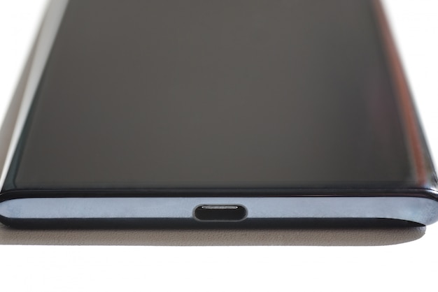 Usb type-c connector on the end of the smartphone, close-up