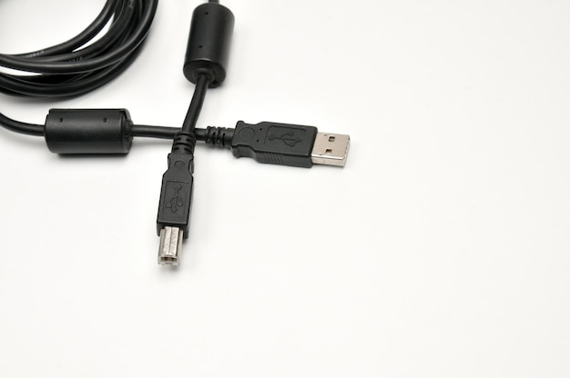 USB A and USB B printer plug cable on white background