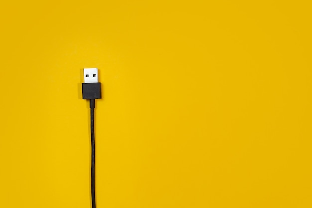 USB wires on a yellow background