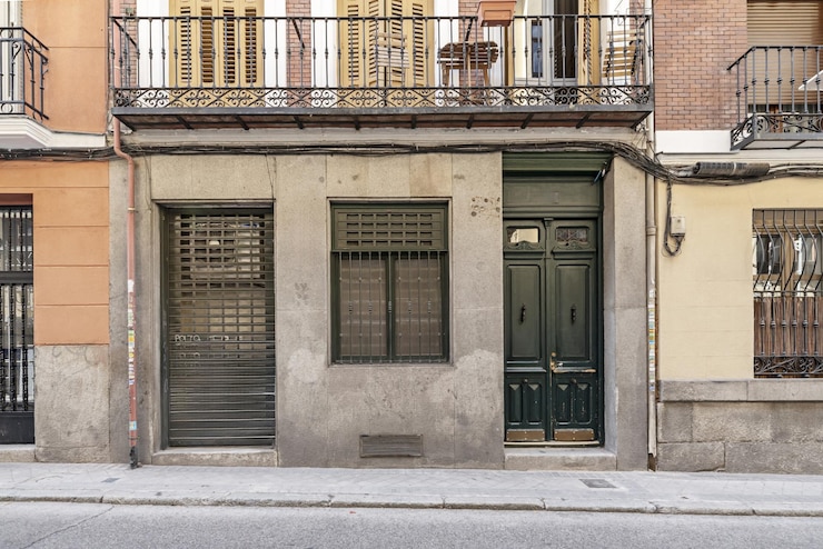 Photo the use of large windows balconies and terraces is also common in this type of facade